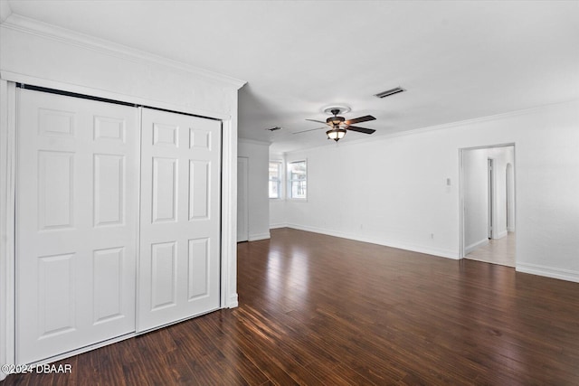 unfurnished living room with dark hardwood / wood-style floors, ceiling fan, and crown molding