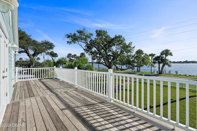 deck featuring a yard and a water view