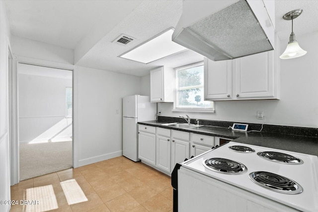 kitchen featuring custom range hood, sink, white cabinets, and white appliances