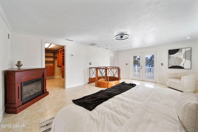 tiled bedroom with access to outside, ornamental molding, and french doors