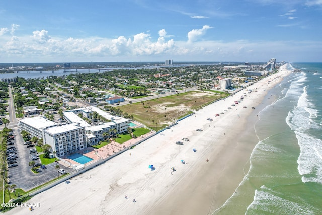 aerial view featuring a water view and a beach view