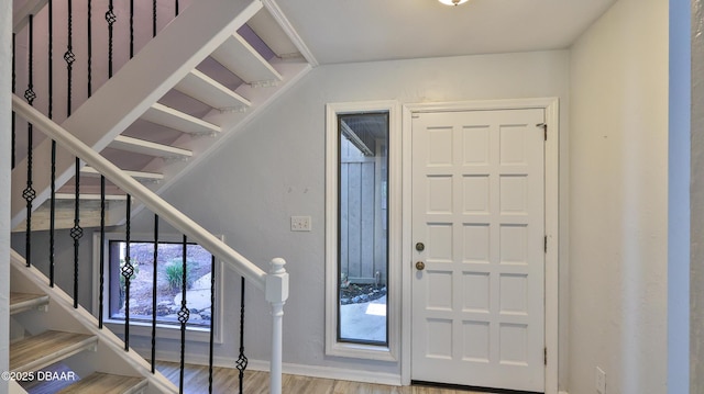 8 Fox Run Trl, Ormond Beach, FL 32174 - foyer entrance featuring stairs and wood finished floors