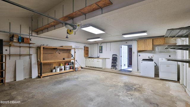 8 Fox Run Trl, Ormond Beach, FL 32174 - garage with electric panel, separate washer and dryer, a garage door opener, and a workshop area