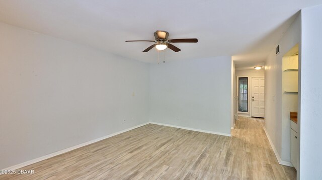 8 Fox Run Trl, Ormond Beach, FL 32174 - empty room with light wood-type flooring and ceiling fan