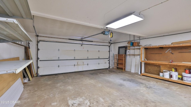 8 Fox Run Trl, Ormond Beach, FL 32174 - garage featuring a workshop area and a garage door opener