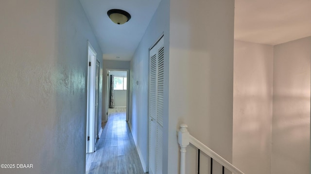 8 Fox Run Trl, Ormond Beach, FL 32174 - hallway featuring an upstairs landing and wood finished floors