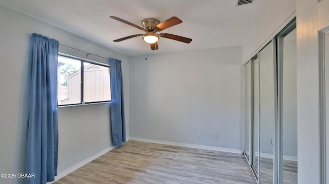 8 Fox Run Trl, Ormond Beach, FL 32174 - unfurnished bedroom with a closet, light wood-style floors, and ceiling fan