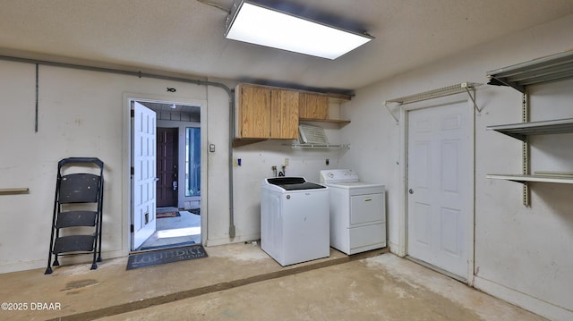 8 Fox Run Trl, Ormond Beach, FL 32174 - laundry area featuring separate washer and dryer and cabinet space