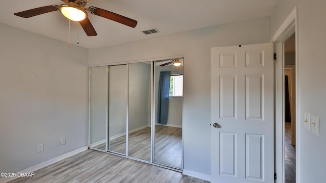 8 Fox Run Trl, Ormond Beach, FL 32174 - unfurnished bedroom featuring wood finished floors, a closet, and ceiling fan