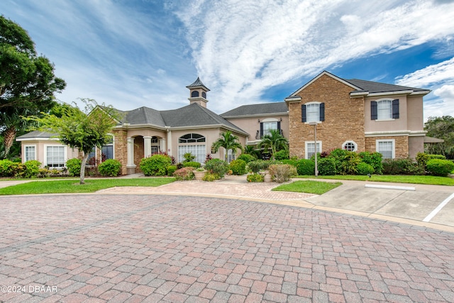 view of front of house featuring a porch and a front yard