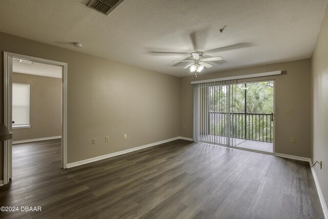 940 Village Trl Unit 2-207, Port Orange, FL 32127 - spare room with ceiling fan, dark wood-type flooring, a textured ceiling, and baseboards