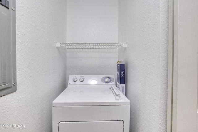 940 Village Trl Unit 2-207, Port Orange, FL 32127 - washroom with washer / dryer and a textured wall