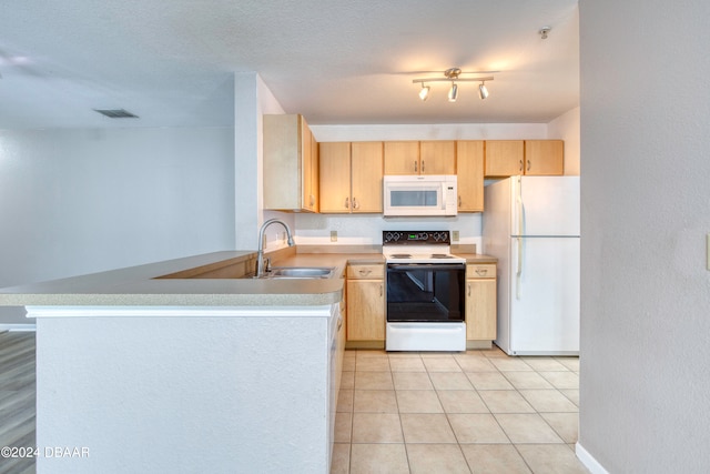 kitchen with kitchen peninsula, sink, light tile patterned flooring, light brown cabinetry, and white appliances