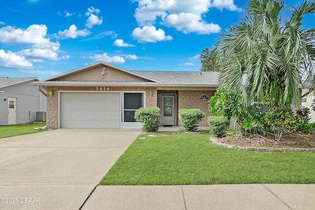 single story home featuring a front yard, central AC, and a garage