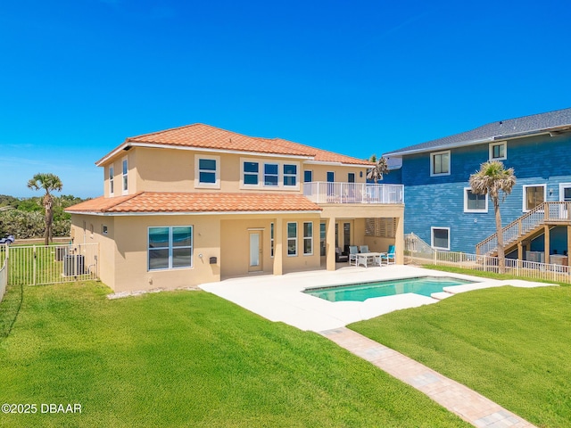 4427 S Atlantic Ave, Ponce Inlet, FL 32127 - rear view of house with a balcony, stucco siding, a patio, and cooling unit