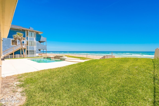 4427 S Atlantic Ave, Ponce Inlet, FL 32127 - swimming pool featuring a yard, a patio, and view of water and beach