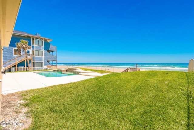4427 S Atlantic Ave, Ponce Inlet, FL 32127 - swimming pool featuring a yard, a patio, and view of water and beach