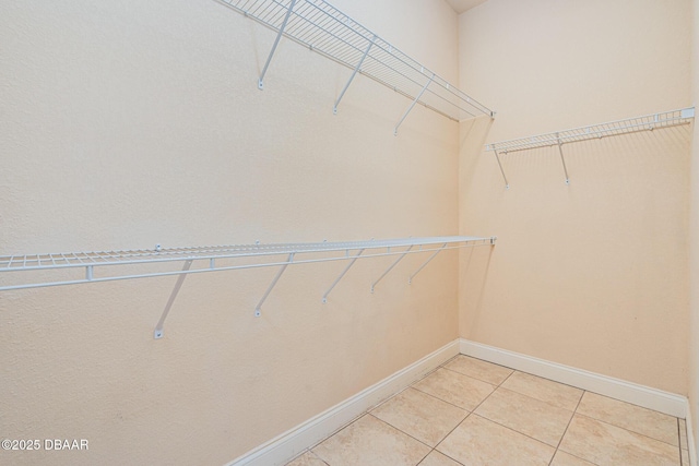 4427 S Atlantic Ave, Ponce Inlet, FL 32127 - walk in closet featuring light tile patterned floors