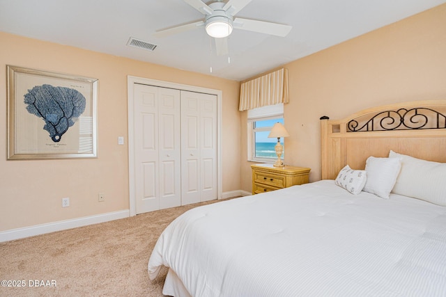 4427 S Atlantic Ave, Ponce Inlet, FL 32127 - carpeted bedroom with a closet, baseboards, and ceiling fan