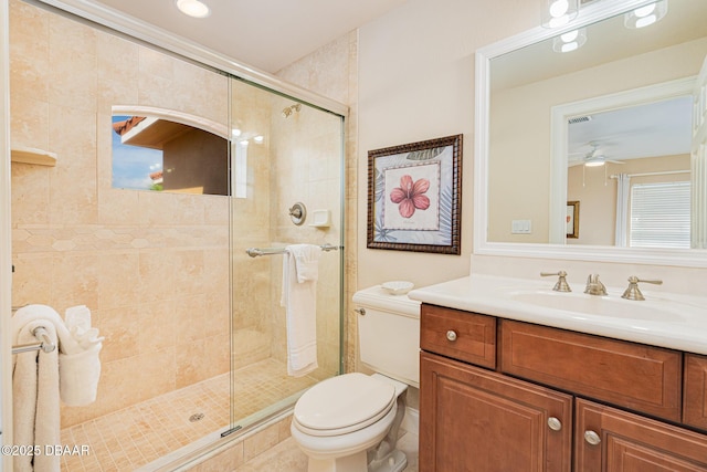 4427 S Atlantic Ave, Ponce Inlet, FL 32127 - full bath featuring a stall shower, toilet, vanity, a ceiling fan, and tile patterned flooring