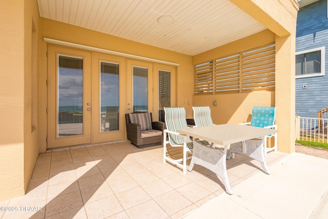 4427 S Atlantic Ave, Ponce Inlet, FL 32127 - view of patio / terrace with french doors and outdoor dining space