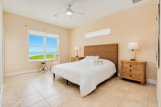 4427 S Atlantic Ave, Ponce Inlet, FL 32127 - bedroom with baseboards, light tile patterned flooring, and ceiling fan