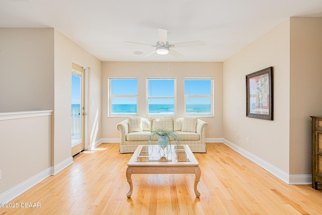 4427 S Atlantic Ave, Ponce Inlet, FL 32127 - living room with ceiling fan, light wood-style flooring, and baseboards