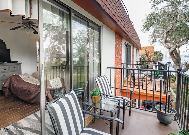 balcony featuring ceiling fan