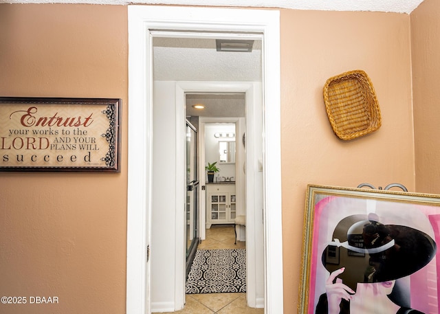 hallway with light tile patterned floors