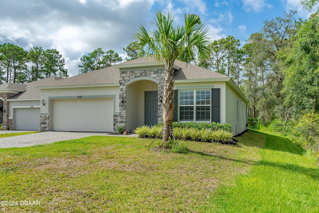 ranch-style house featuring a garage and a front yard