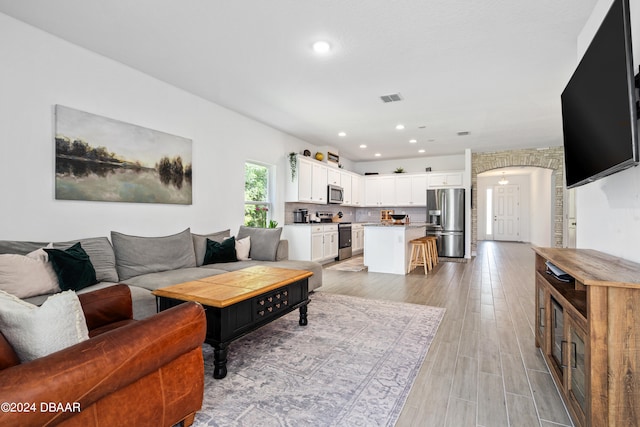 living room with light hardwood / wood-style floors