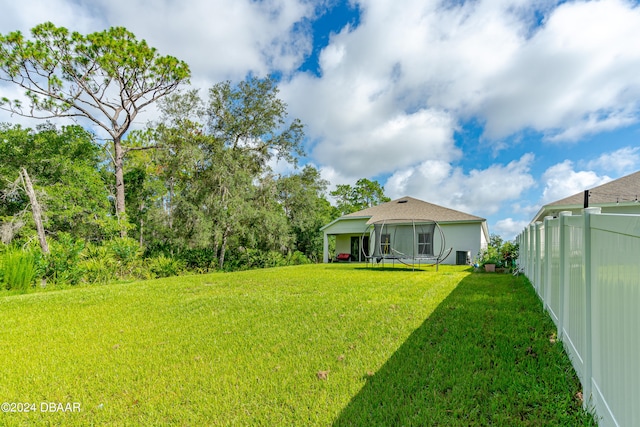 view of yard with a sunroom