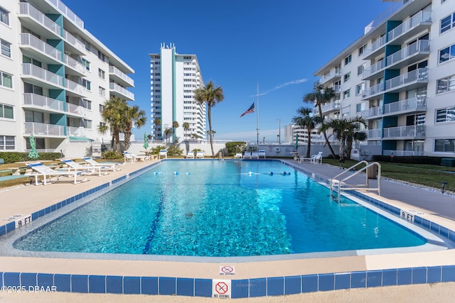 community pool with a patio area