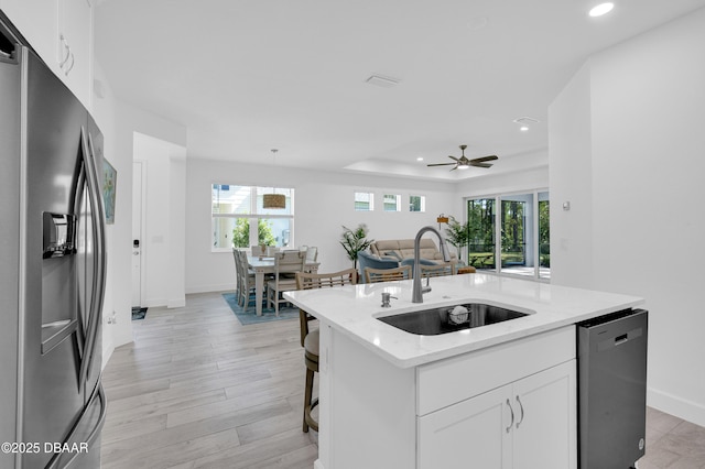 802 Margaritaville Ave, Daytona Beach, FL 32124 - kitchen with stainless steel fridge with ice dispenser, a sink, dishwasher, recessed lighting, and white cabinetry