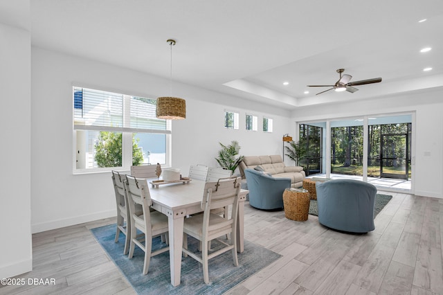 802 Margaritaville Ave, Daytona Beach, FL 32124 - dining space with recessed lighting, light wood-style flooring, a raised ceiling, a ceiling fan, and baseboards