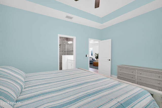 802 Margaritaville Ave, Daytona Beach, FL 32124 - bedroom with a ceiling fan, connected bathroom, and baseboards