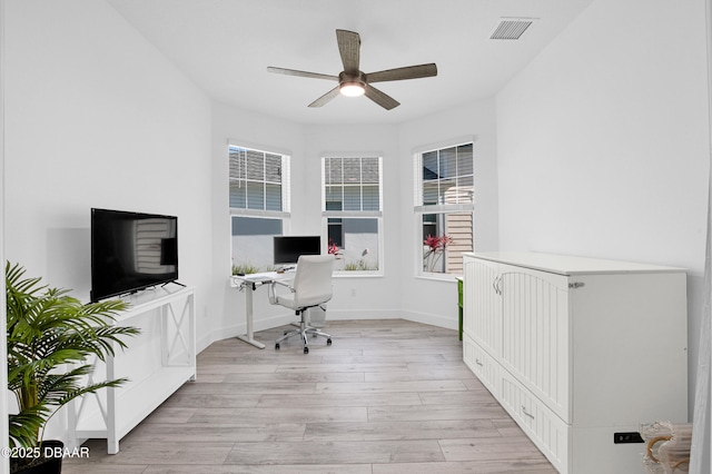 802 Margaritaville Ave, Daytona Beach, FL 32124 - home office featuring light wood-style flooring, ceiling fan, healthy amount of natural light, and baseboards