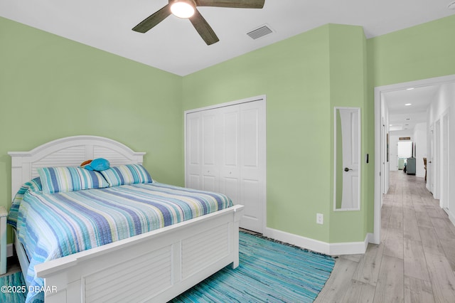 802 Margaritaville Ave, Daytona Beach, FL 32124 - bedroom with baseboards, light wood-style floors, a closet, and a ceiling fan
