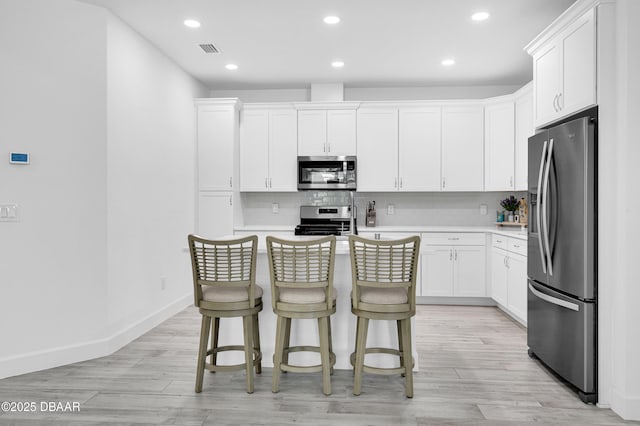 802 Margaritaville Ave, Daytona Beach, FL 32124 - kitchen featuring appliances with stainless steel finishes, backsplash, light countertops, and recessed lighting