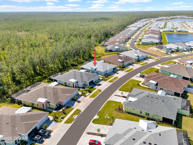 802 Margaritaville Ave, Daytona Beach, FL 32124 - aerial view of residential area featuring a forest and a nearby body of water