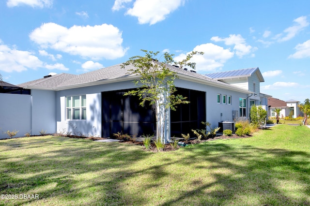 802 Margaritaville Ave, Daytona Beach, FL 32124 - back of house with a yard, central air condition unit, and stucco siding