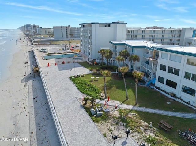 birds eye view of property featuring a water view and a city view