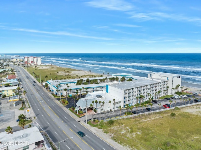 drone / aerial view with a view of the beach and a water view