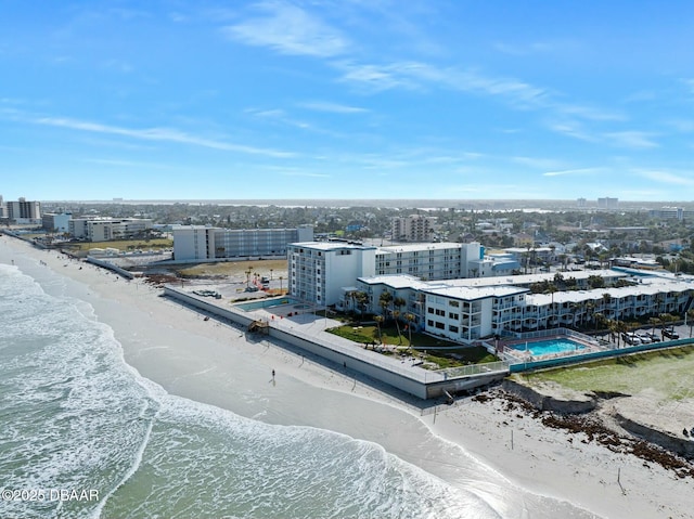 bird's eye view with a water view, a beach view, and a city view