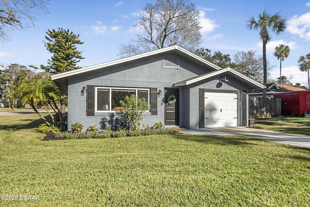 view of front facade with a garage and a front lawn