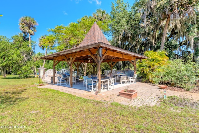 exterior space with a patio area, a yard, and a gazebo