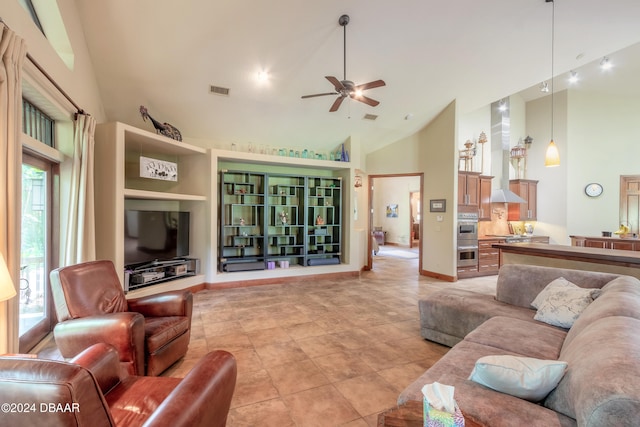 tiled living room featuring high vaulted ceiling, a healthy amount of sunlight, and ceiling fan