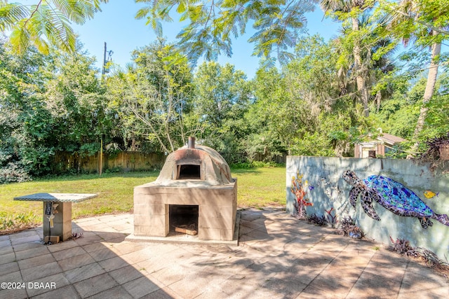 view of patio featuring a tiled fireplace