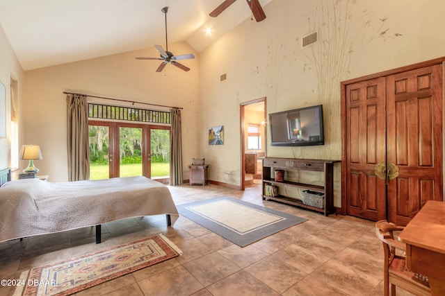 tiled bedroom with ceiling fan, high vaulted ceiling, and access to outside