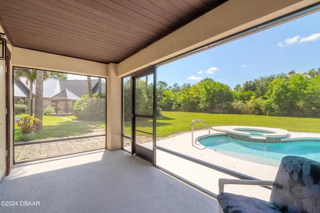 unfurnished sunroom featuring wood ceiling and a jacuzzi